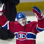Montreal Canadiens' Lars Eller salutes the crowd as he is presented to the crwod for the first star of the game against the Winnipeg Jets during NHL hockey action  Wednesday, January 4, 2012 in Montreal. Eler scored four goals to help his team beat the Jets 7-3. (AP Photo/The Canadian Press, Paul Chiasson)