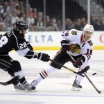 LOS ANGELES, CA - JUNE 04: Jonathan Toews #19 of the Chicago Blackhawks shoots the puck into Kings zone past Jarret Stoll #28 of the Los Angeles Kings in the first period of Game Three of the Western Conference Final during the 2013 NHL Stanley Cup Playoffs at Staples Center on June 4, 2013 in Los Angeles, California.
(Photo by Harry How/Getty Images)